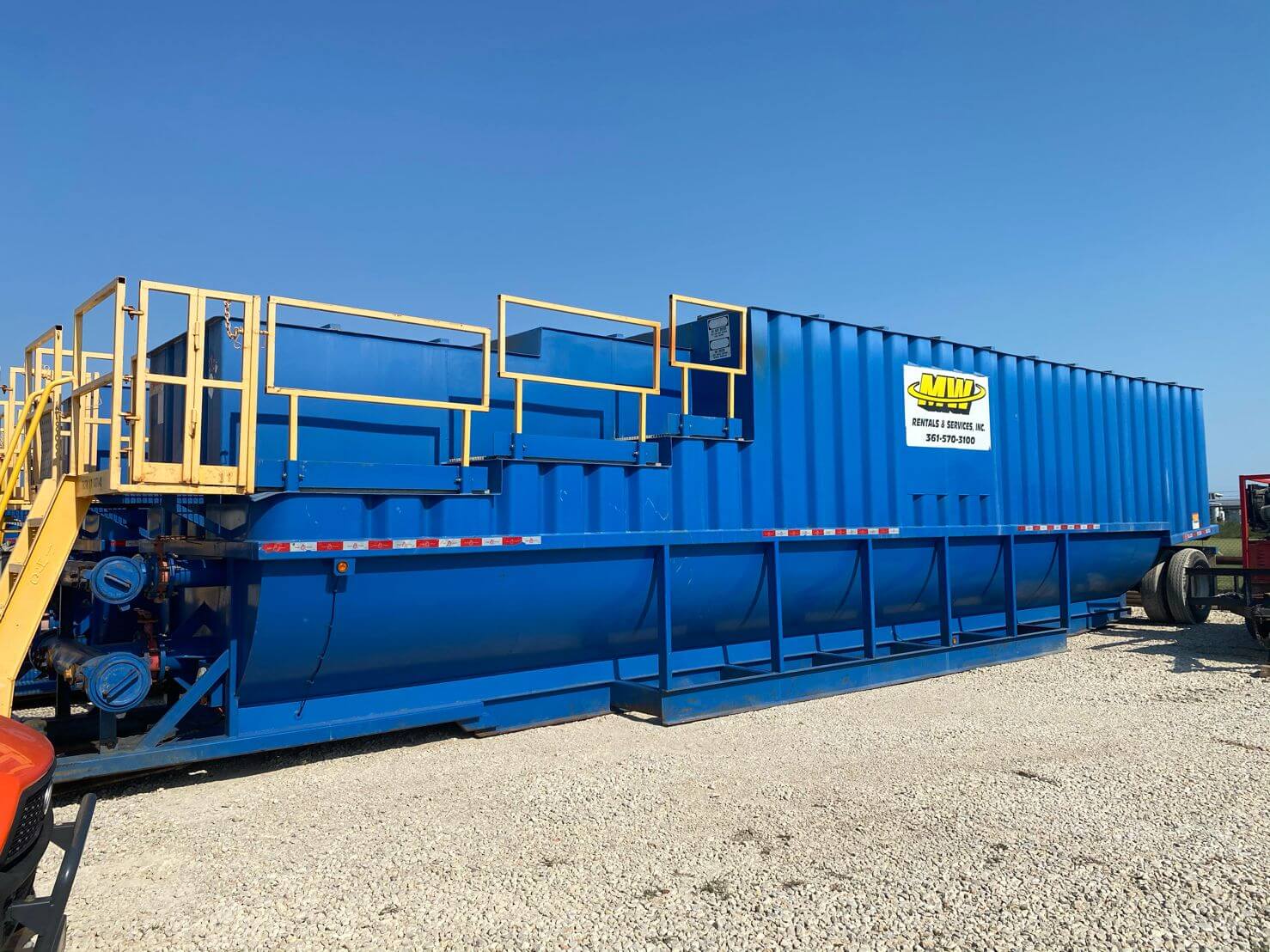 Blue spill tank with yellow stairs